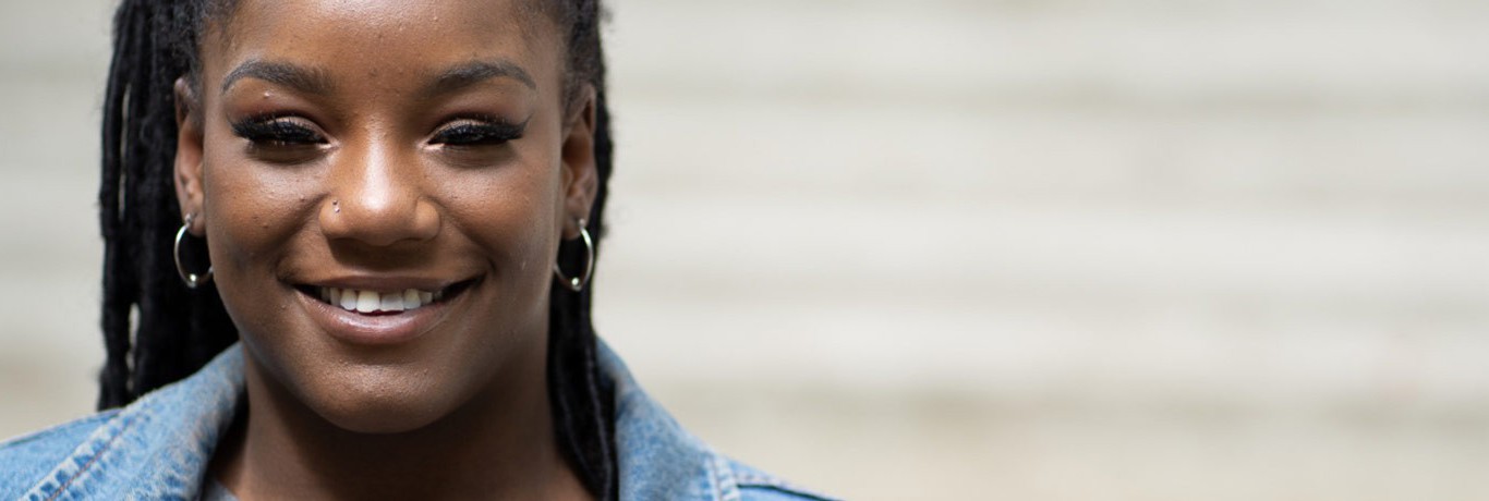 Woman smiling at camera - wide shot